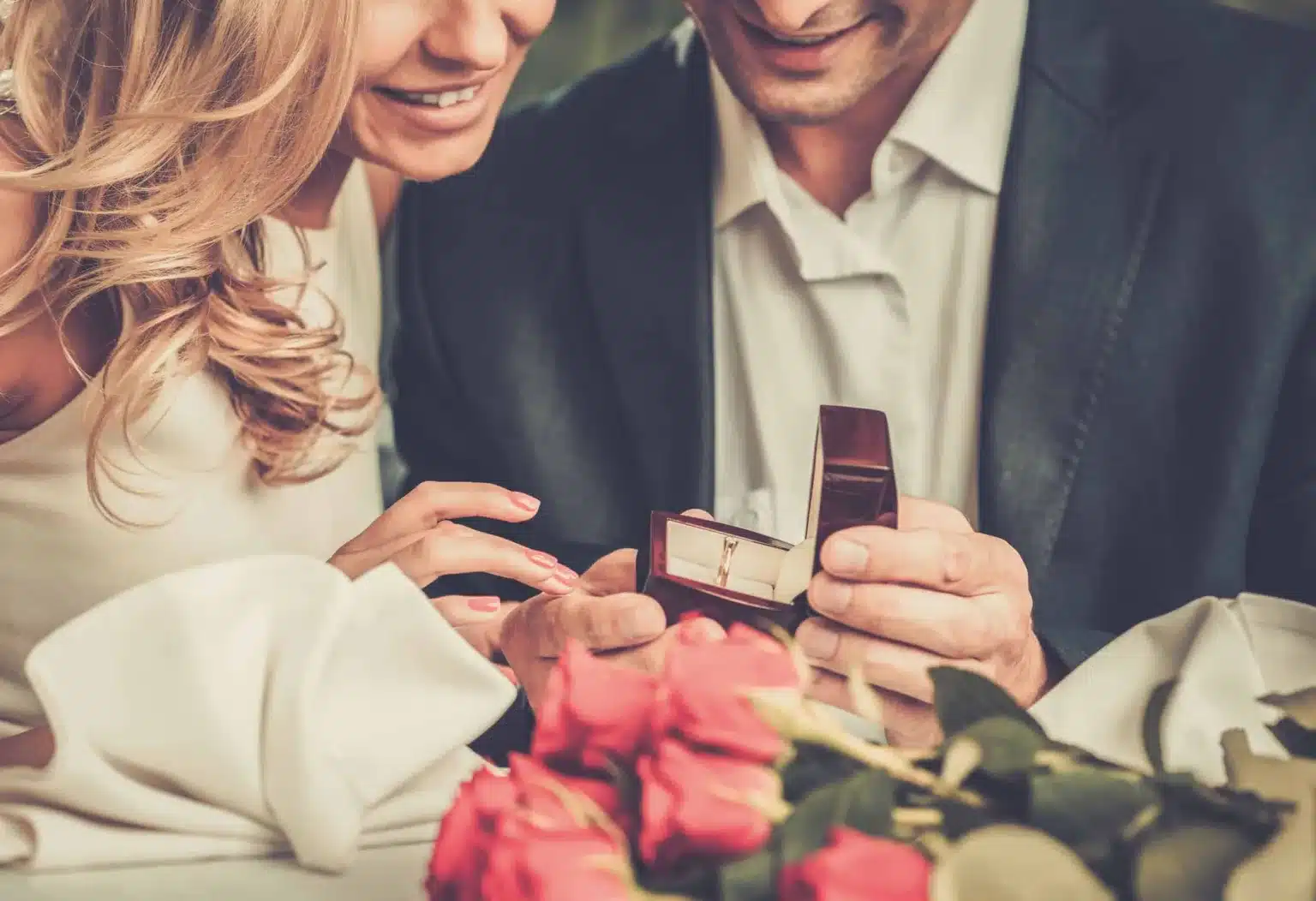 Man Holding Box With Ring Making Propose To His Girlfriend