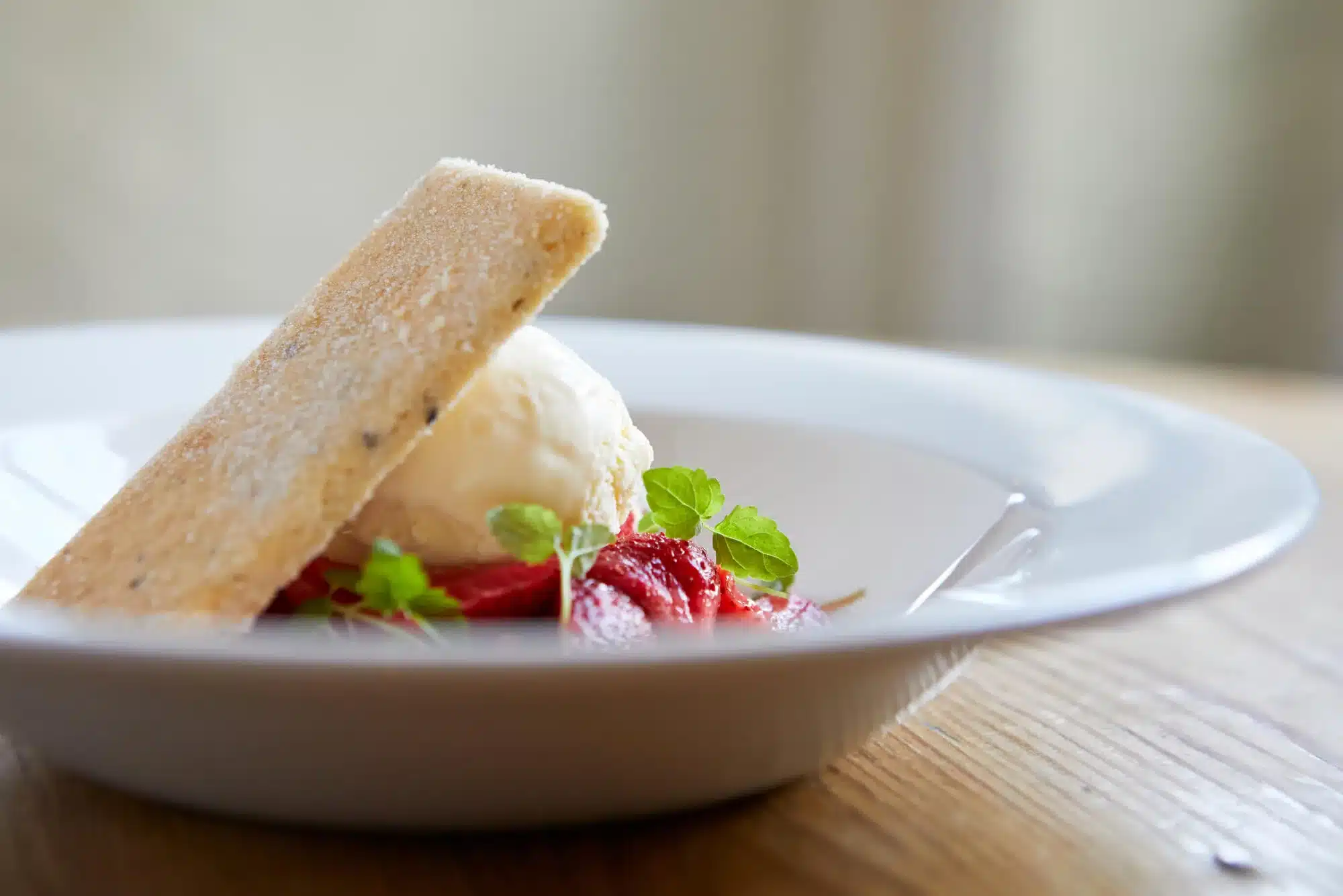 aa poached local strawberries with black pepper shortbread clotted cream ice cream